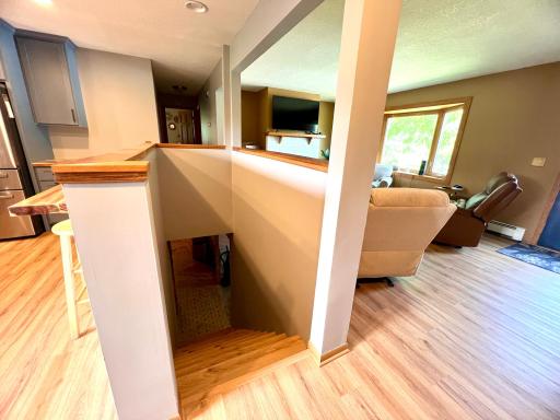 Stairs to Basement looking into living room.jpeg