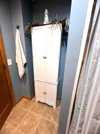 white cabinet comes with the home.jpeg