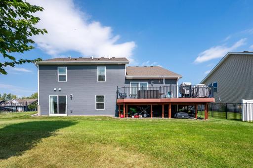 Beautiful back yard! Large deck overlooks this fenced yard.