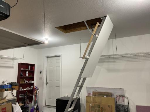 Pull down to extra storage area in garage.