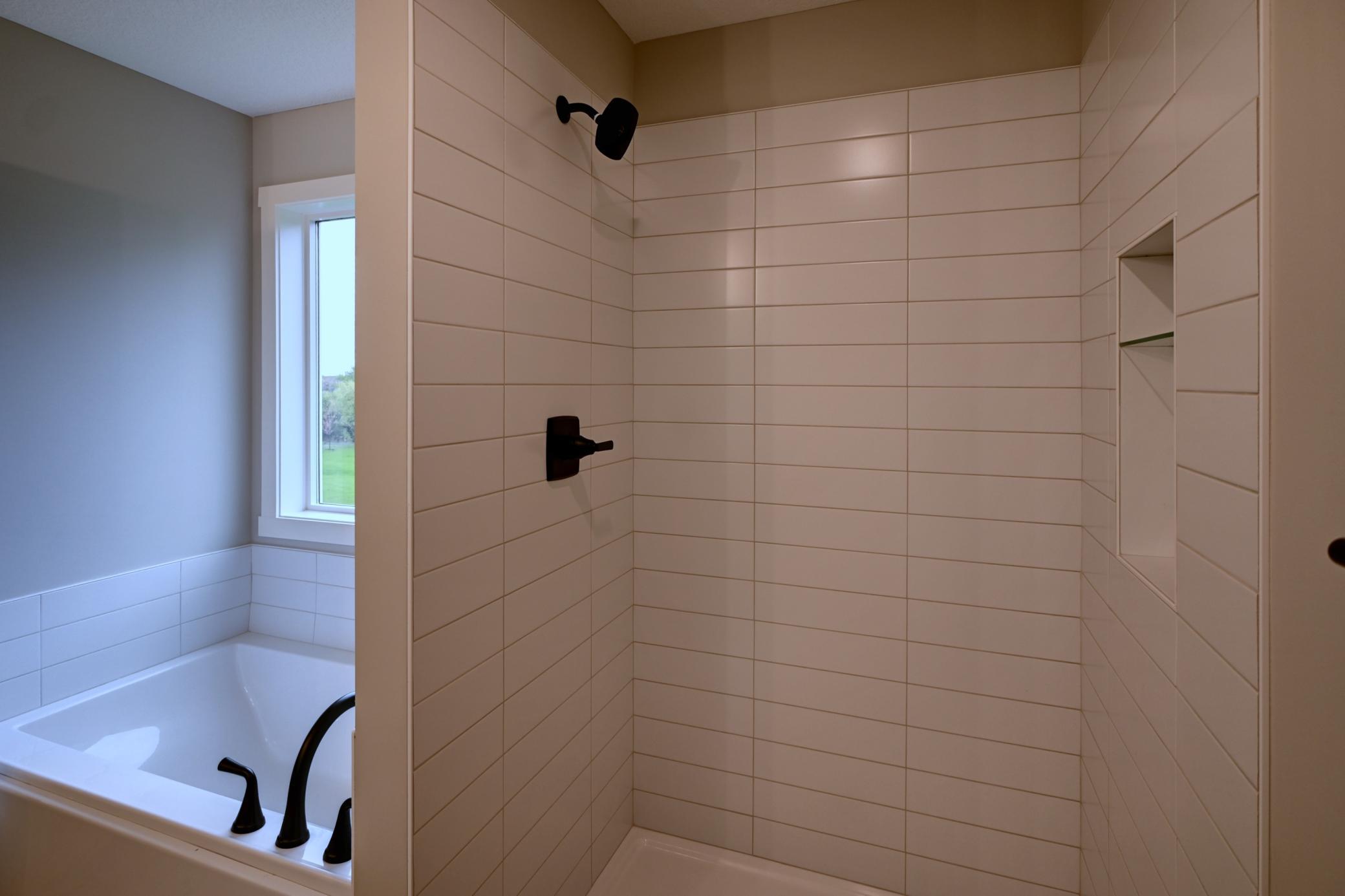Primary Tiled Shower and Soaking Tub