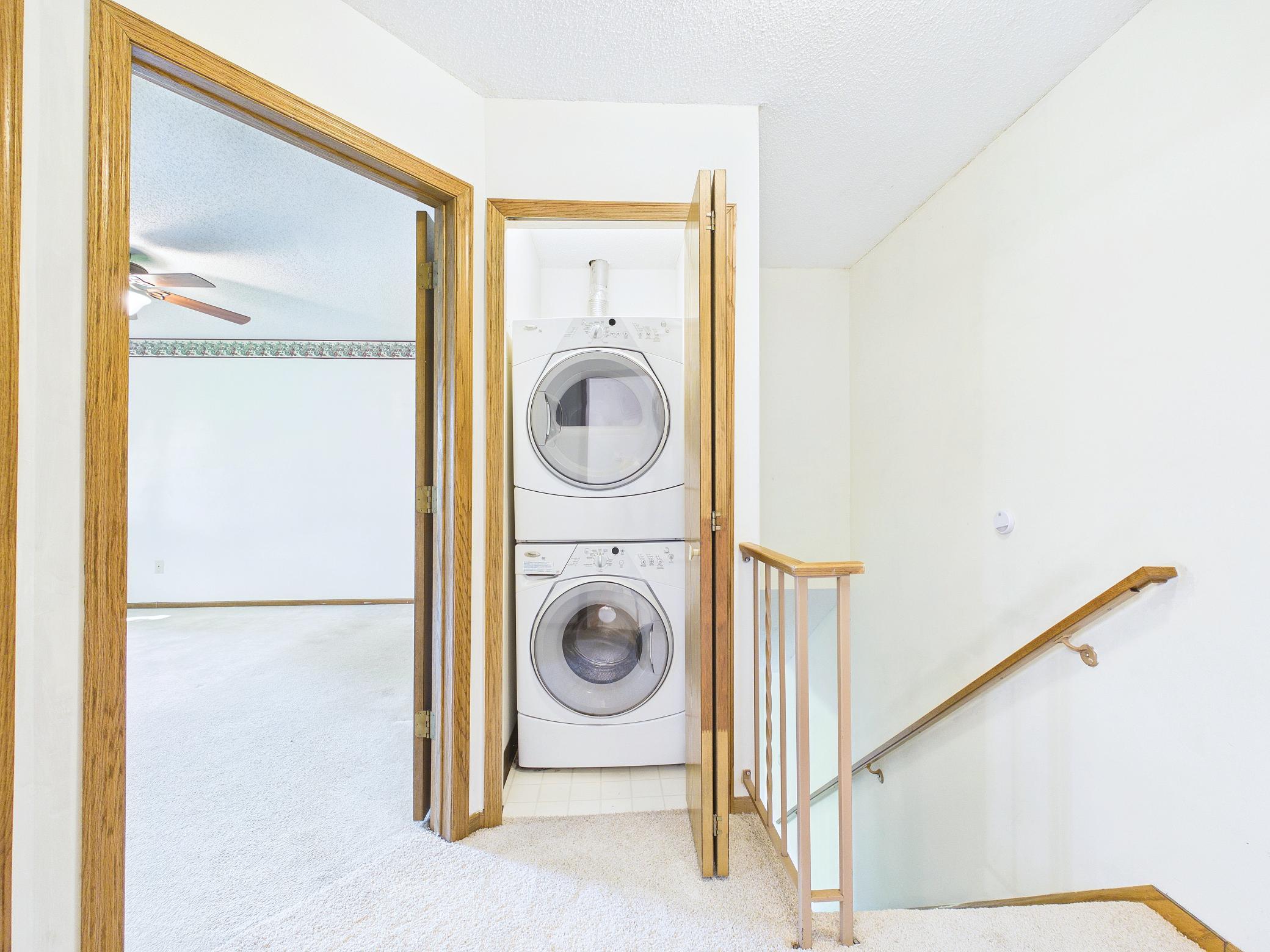 Second floor washer/dryer stack makes laundry a breeze!