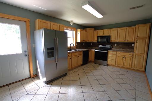 Kitchen Birch Cabinets and Tile Flooring