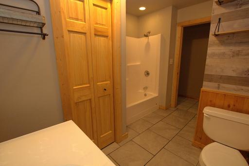 Full Bathroom with Tile Flooring