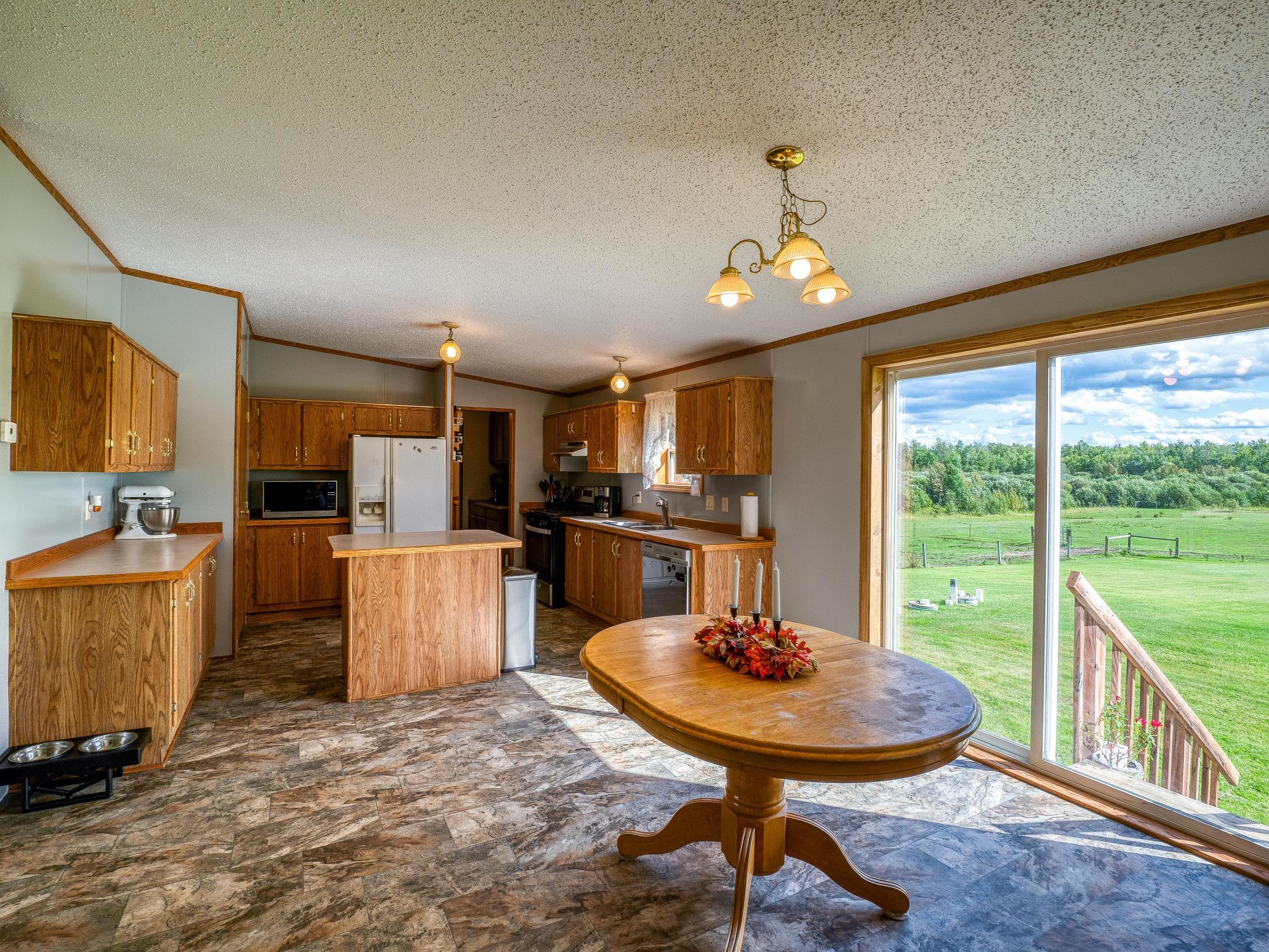 Kitchen is open to the dining area, Full of natural light!