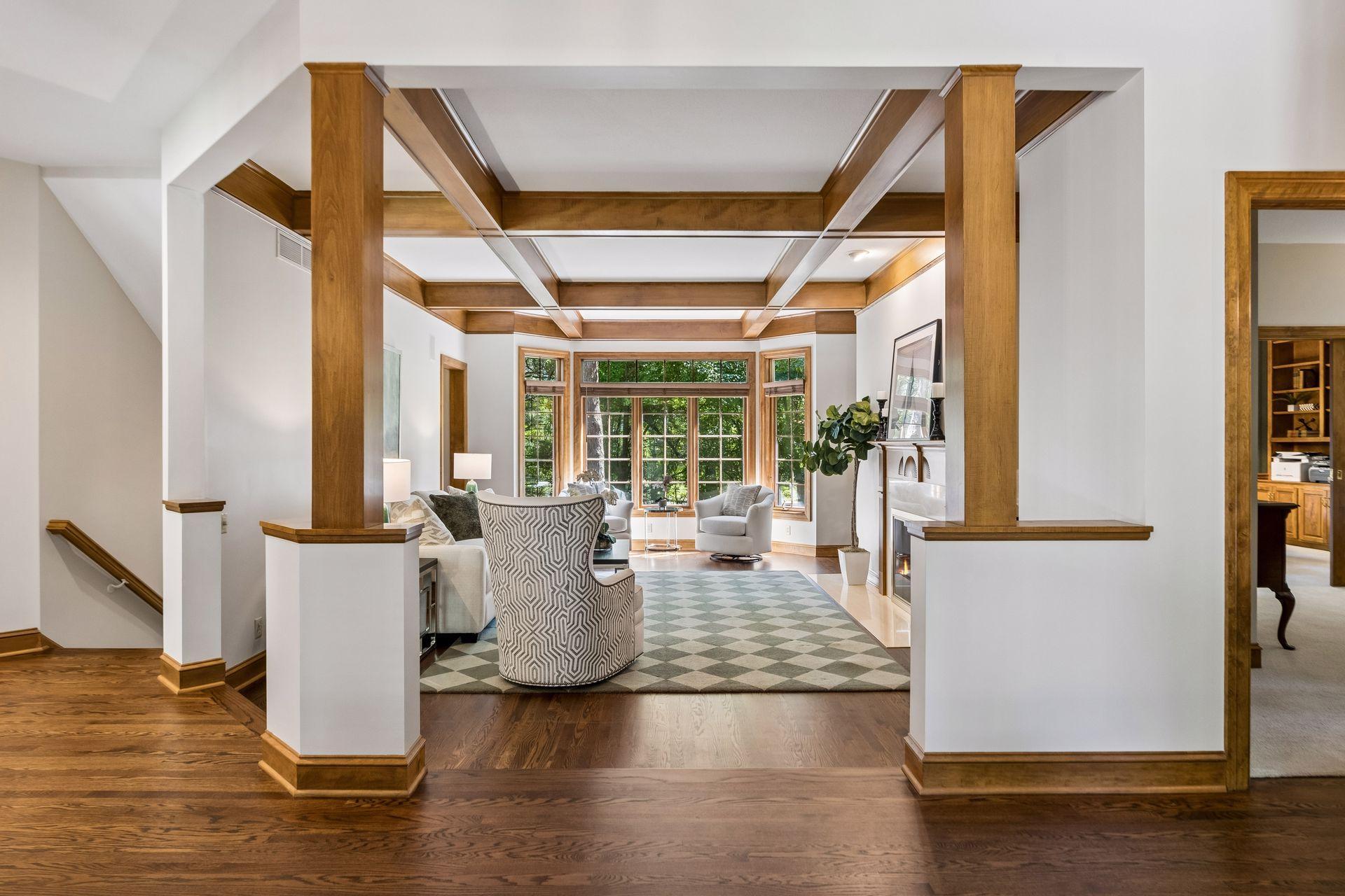 Upon entering, you’re greeted with a direct view of the inviting living room and its coffered ceilings - the entire interior was freshly painted in 2025.