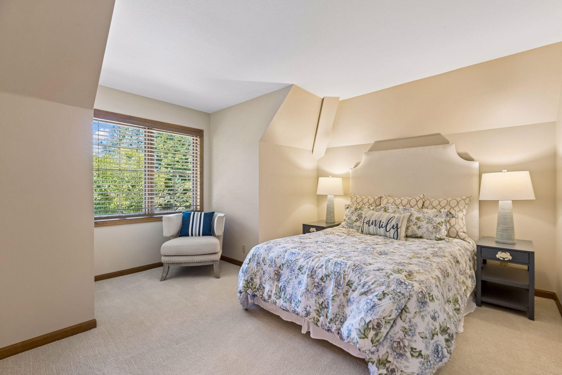 Bedroom 4 on the upper level provides a spacious, inviting setting for guests or family.