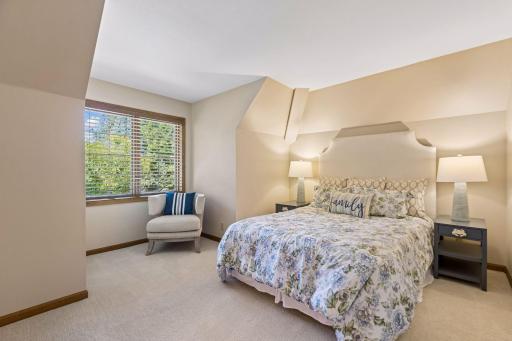 Bedroom 4 on the upper level provides a spacious, inviting setting for guests or family.