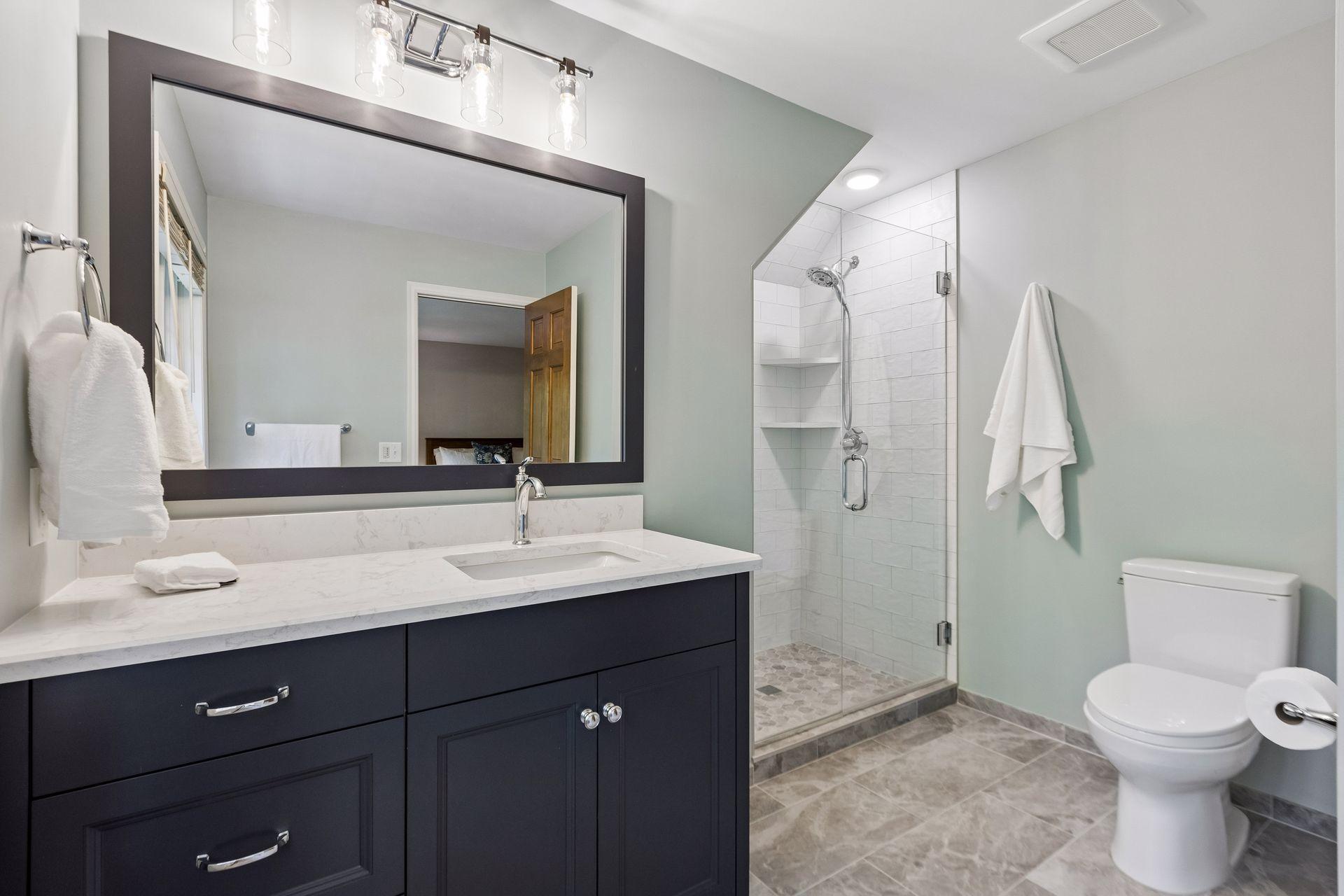 Beautifully updated upper-level primary bedroom with bright finishes and a comfortable layout.