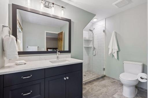 Beautifully updated upper-level primary bedroom with bright finishes and a comfortable layout.