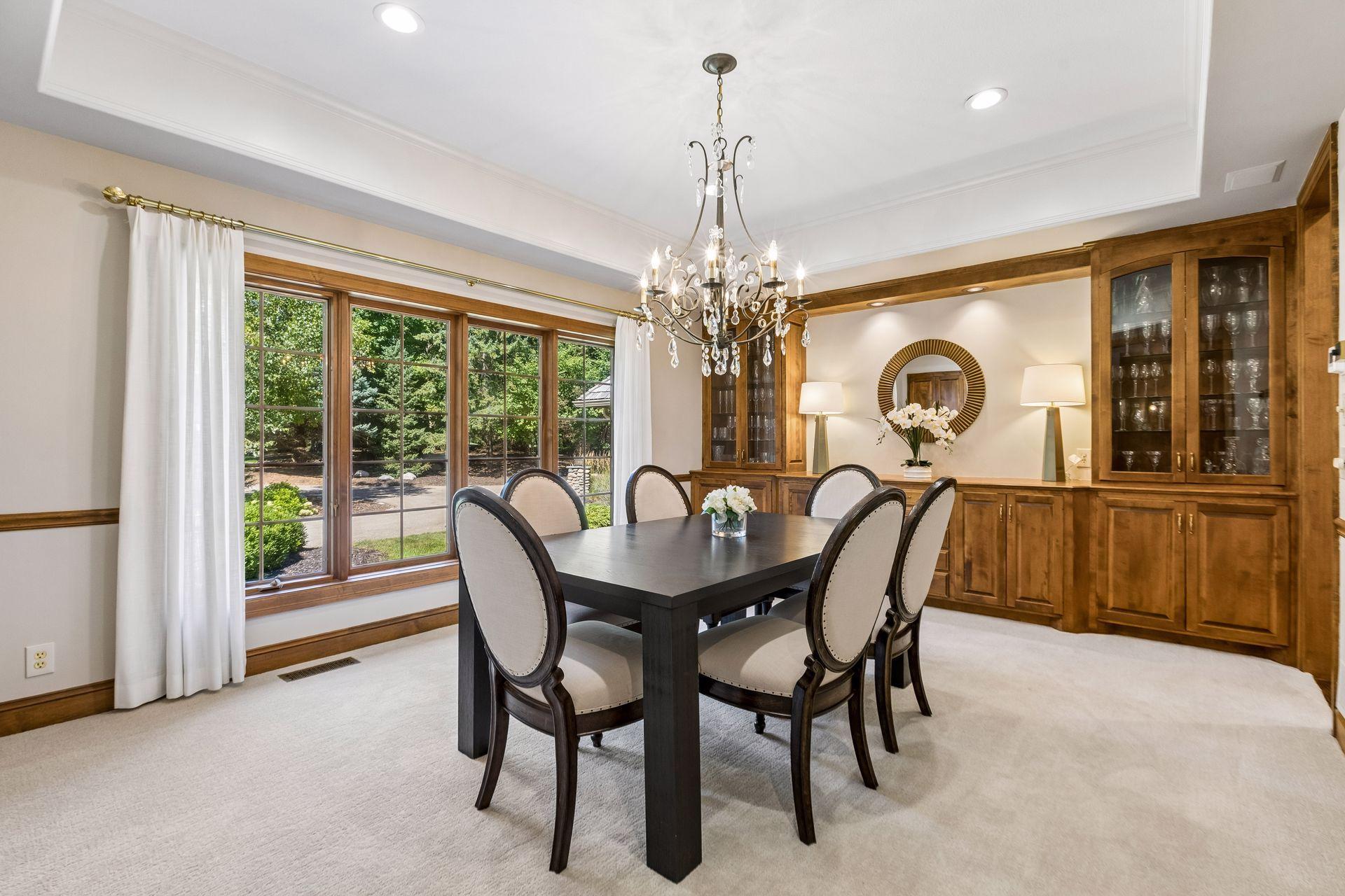 Large formal dining room sits just off the foyer and features custom built-ins.