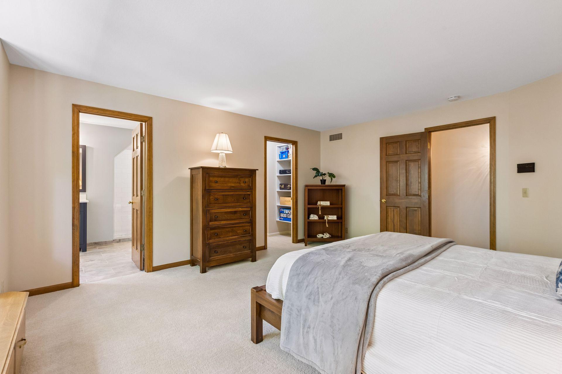 Upper-level Bedroom 2 includes a private ¾ bathroom and a spacious walk-in closet.