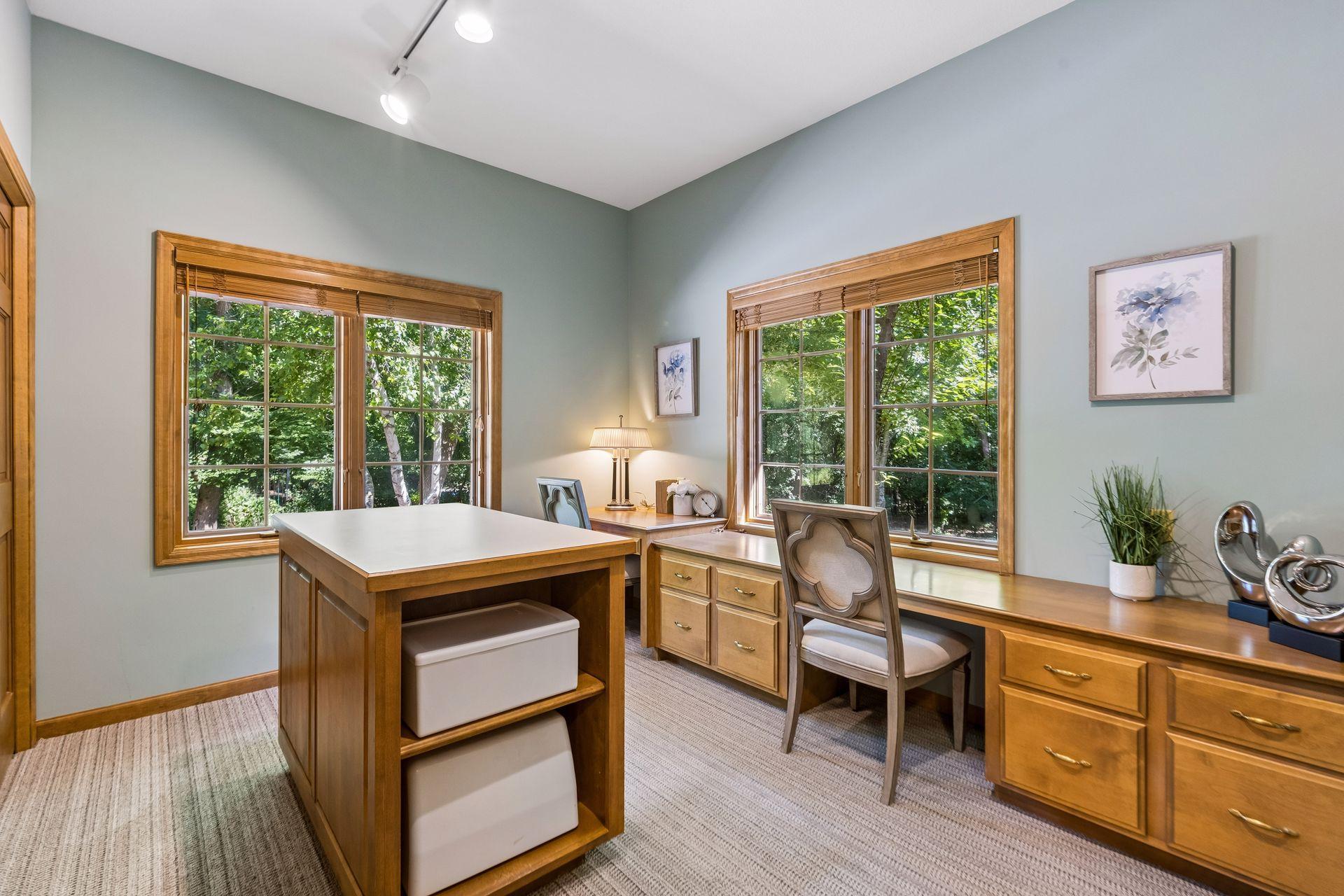 This office/craft room offers a versatile space for work, projects, or creative use.