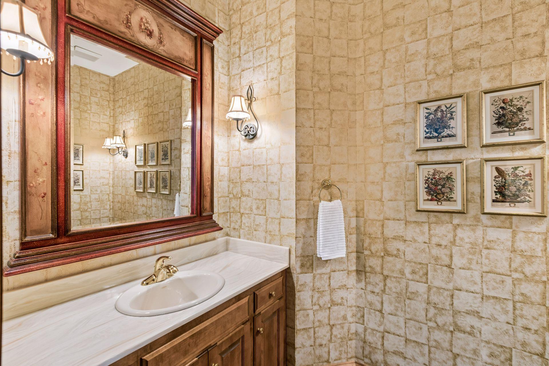 Main-floor half bath located just off the foyer for easy guest access.