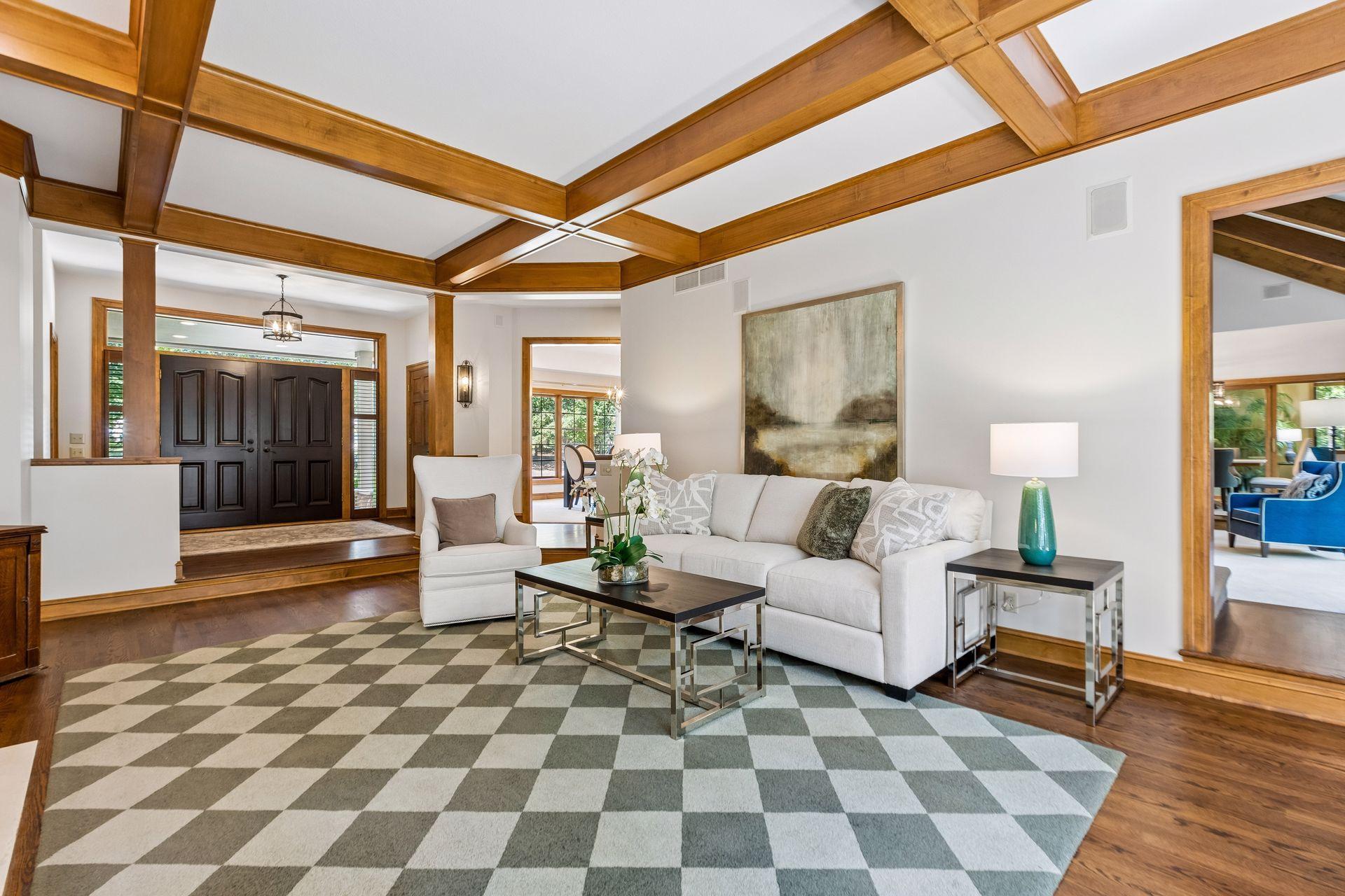 Living room with access to the foyer, family room, and dining area.