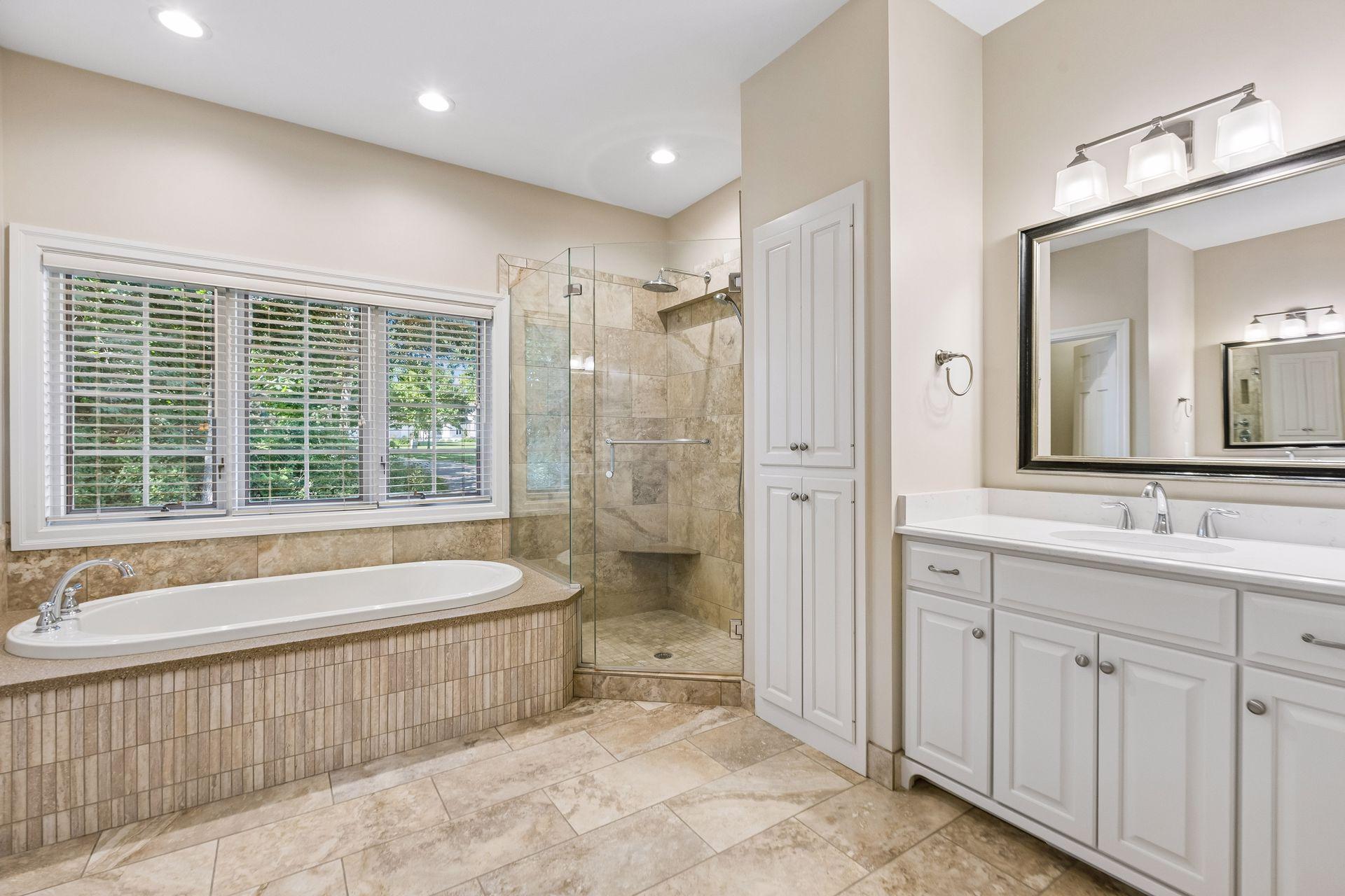 Primary ensuite bathroom updated in 2024, showcasing stylish upgrades and a refreshed look.