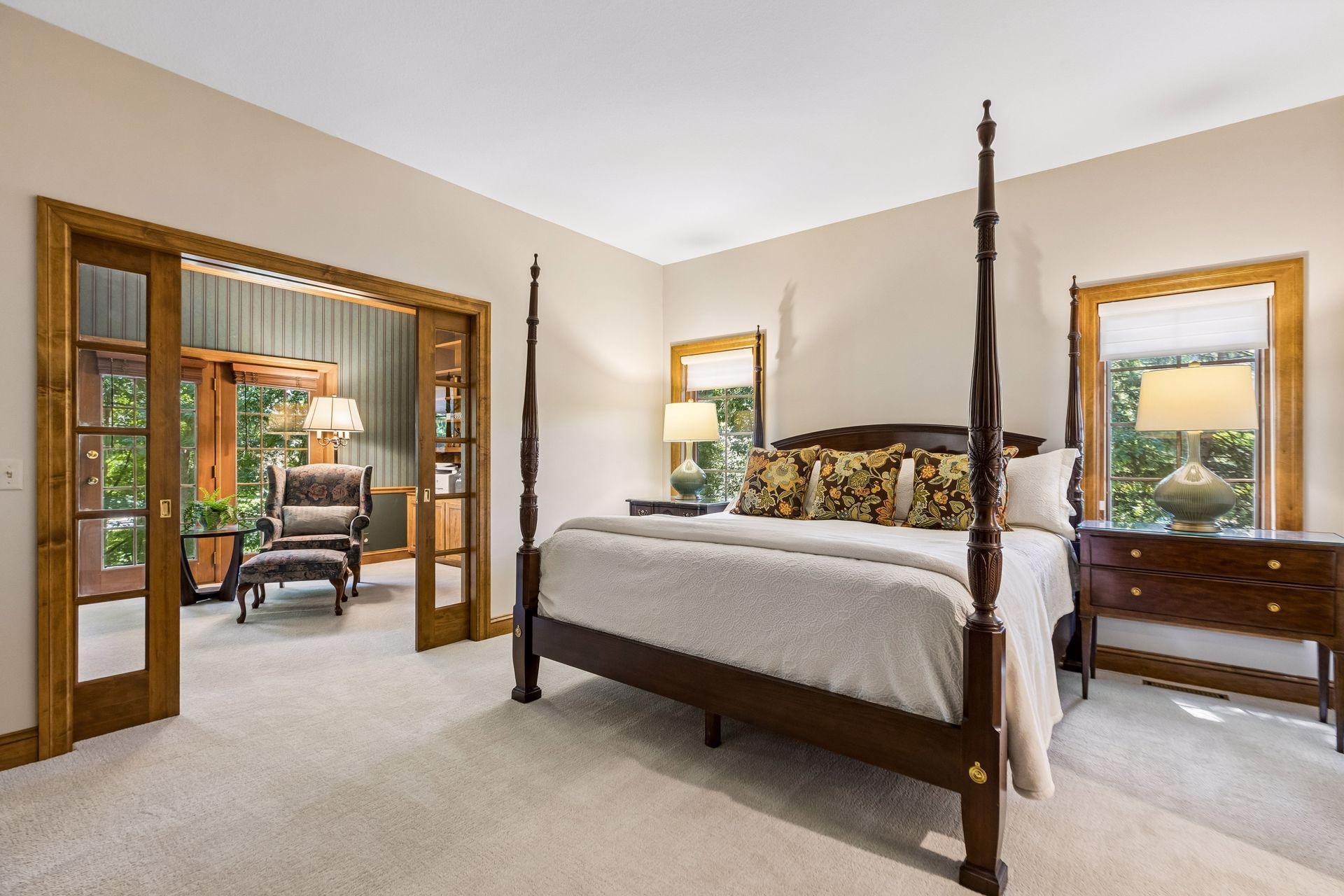 Spacious main-floor primary suite with direct access to the adjoining office.