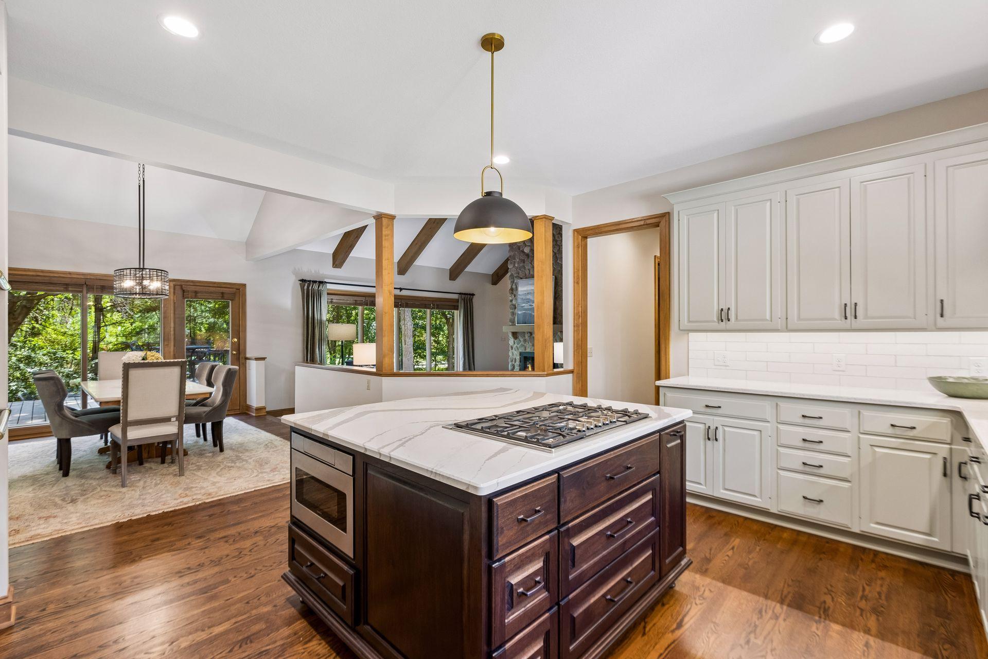 Kitchen opens to the informal dining area and family room for seamless everyday flow.