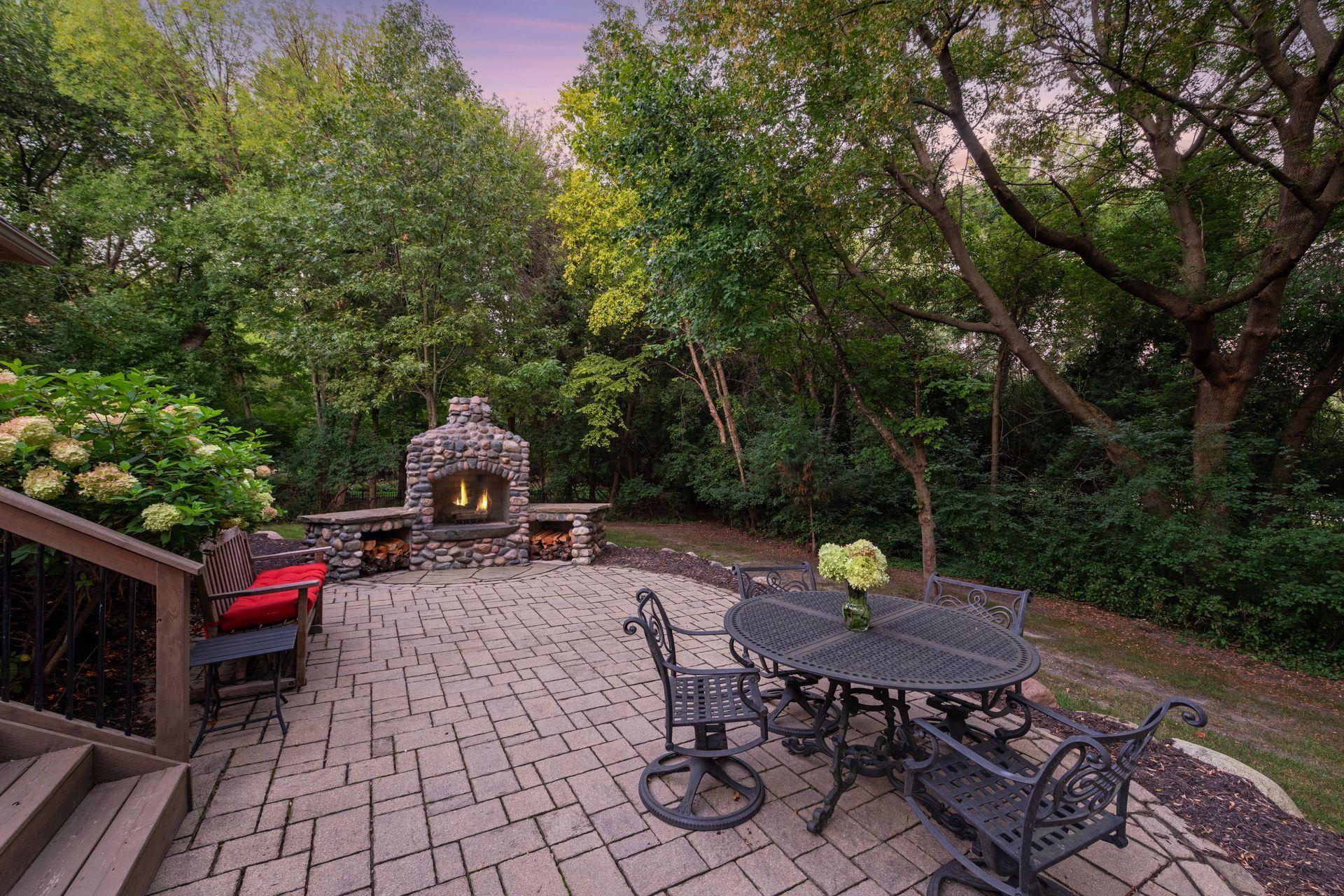 Beautiful newer deck and brick patio complete with an outdoor fireplace.
