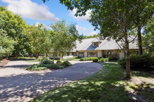 A welcoming, professionally landscaped front yard enhances the homeâs curb appeal.