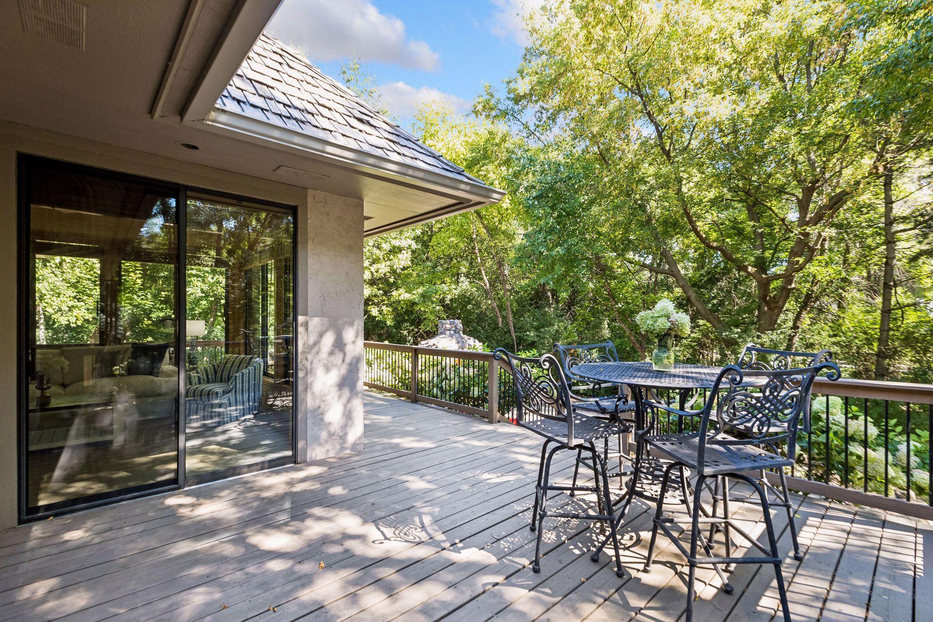 Large backyard deck offering plenty of space for outdoor dining and entertaining.