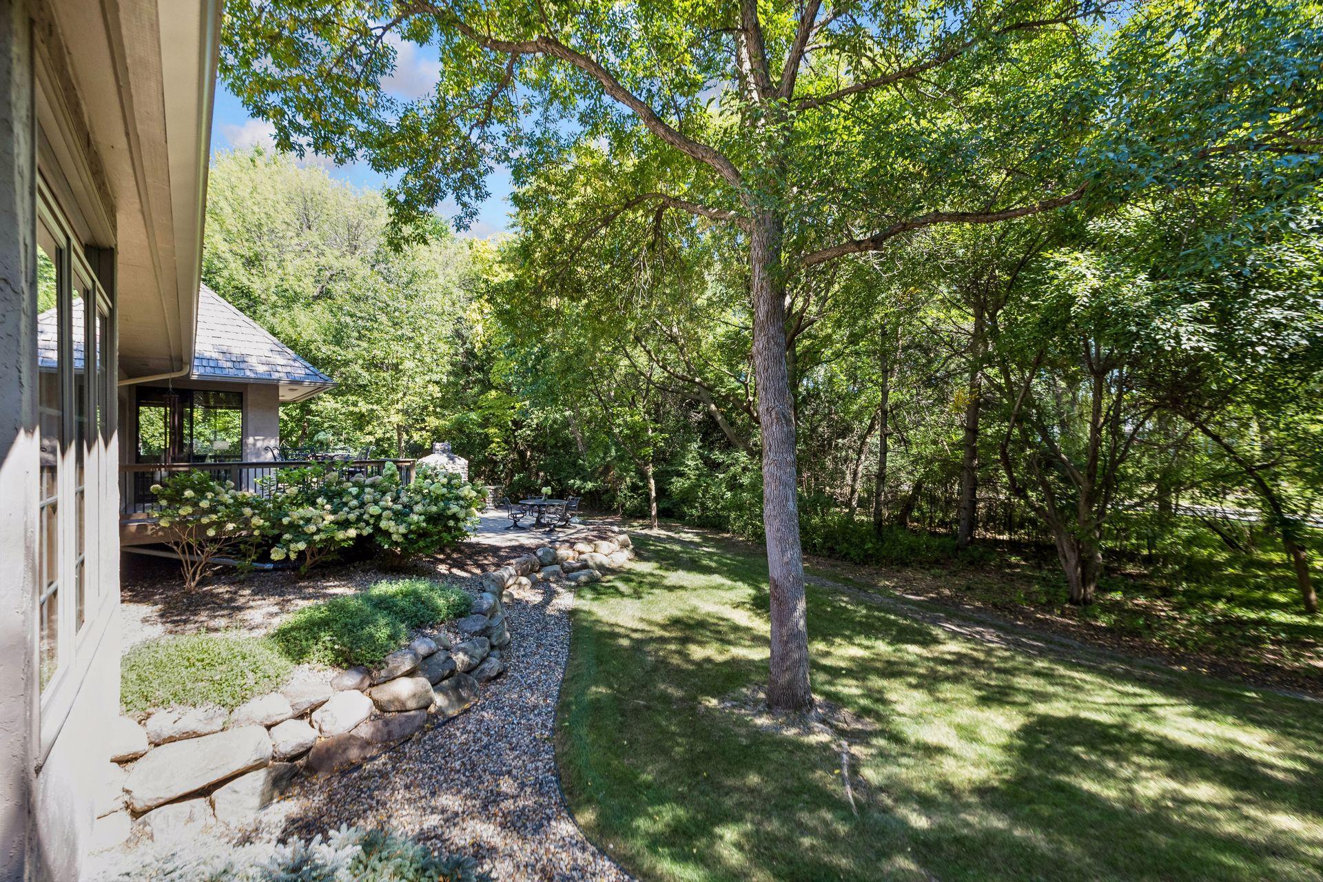 Newly redesigned backyard with updated landscaping that enhances privacy and usability.