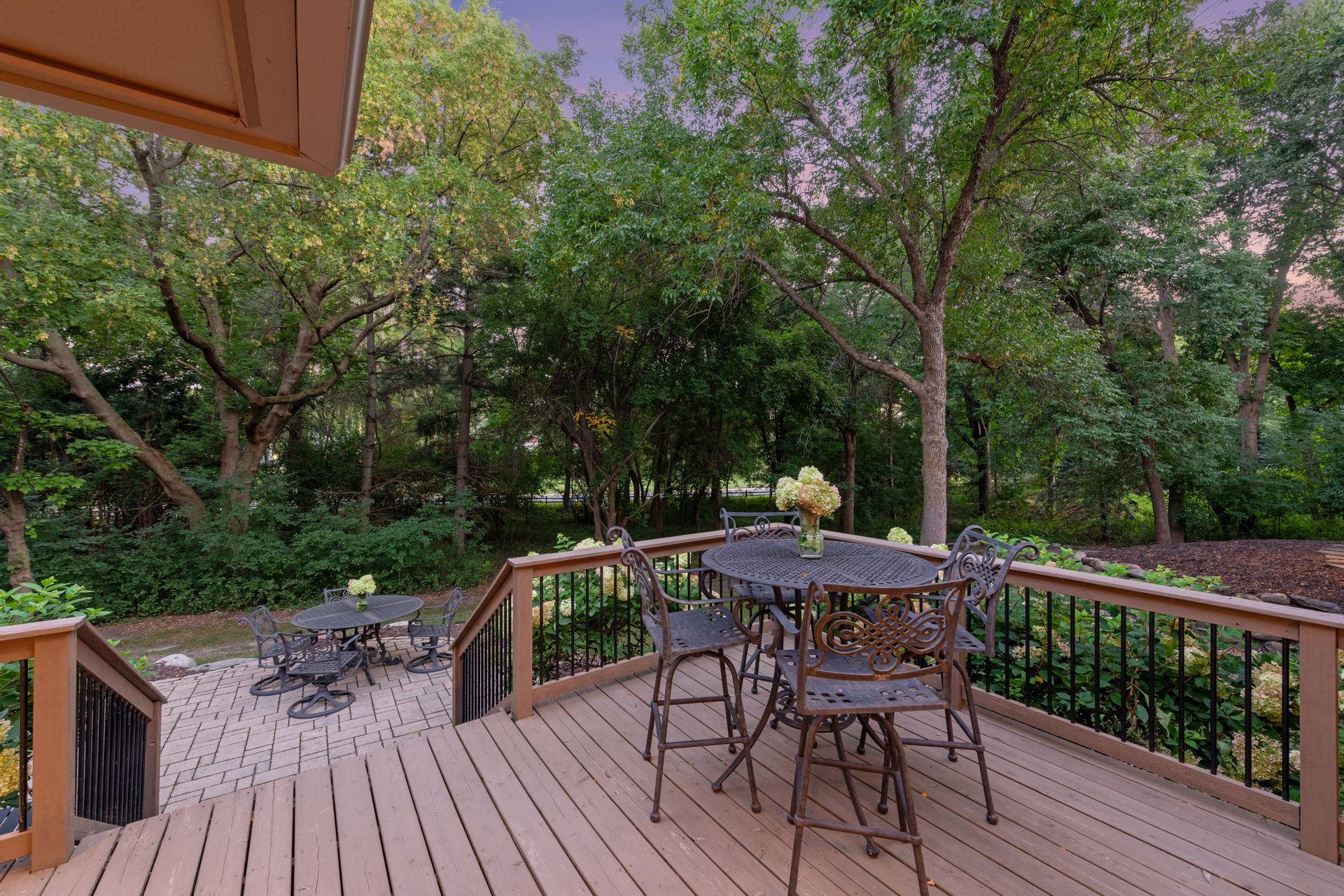 Steps from the deck transition directly to the patio below.