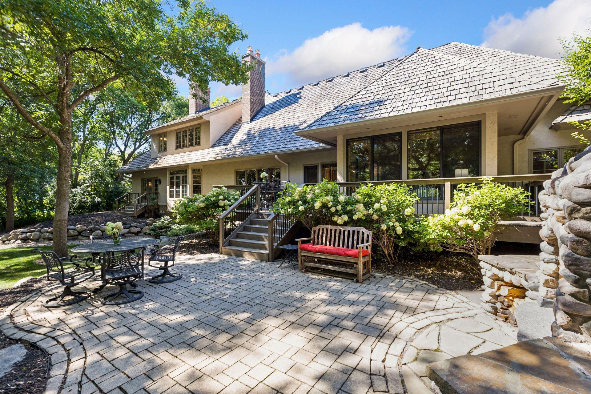 Beautifully updated backyard with refreshed landscaping, a generous patio, and an expansive deck.