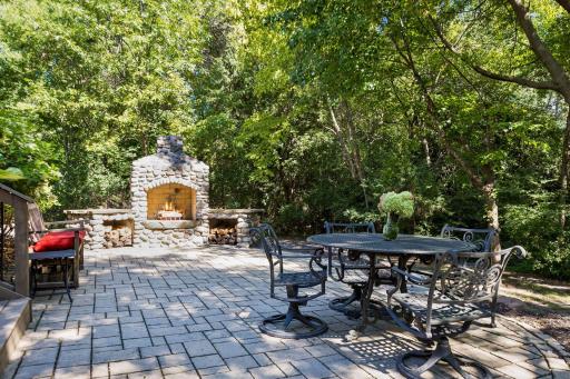 Charming wood-burning fireplace paired with a large patio, perfect for gatherings and relaxation.