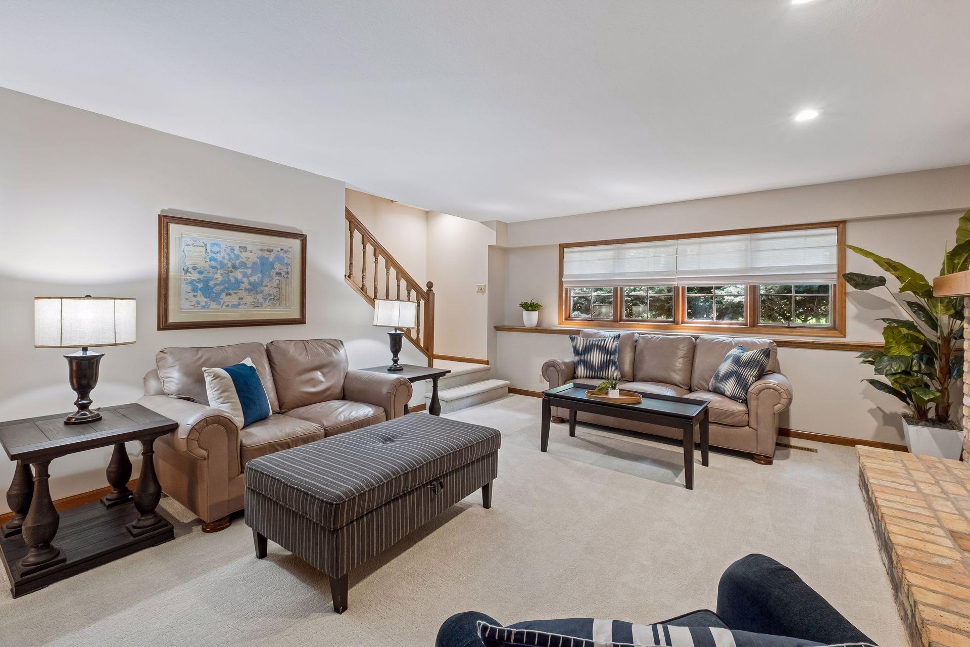 Lower-level family room freshly painted with brand-new carpet.