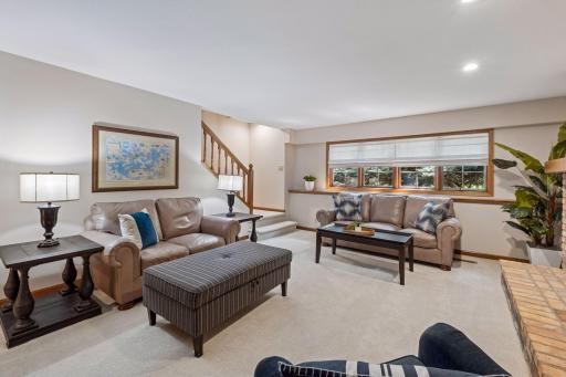 Lower-level family room freshly painted with brand-new carpet.