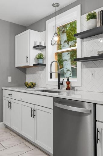 Kitchen window overlooks the large backyard.