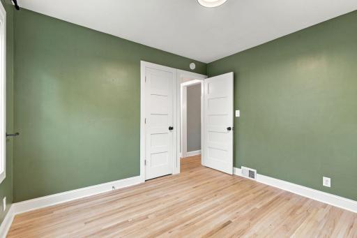 Beautiful hardwood floors and paneled doors.