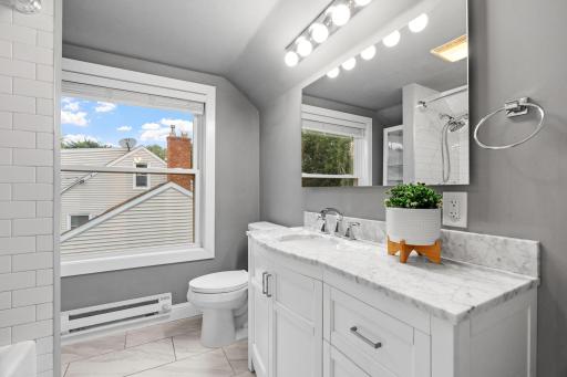 Full bath located in the primary suite/ upper level.