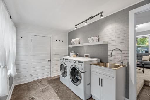 Spacious main floor laundry with utility sink!
