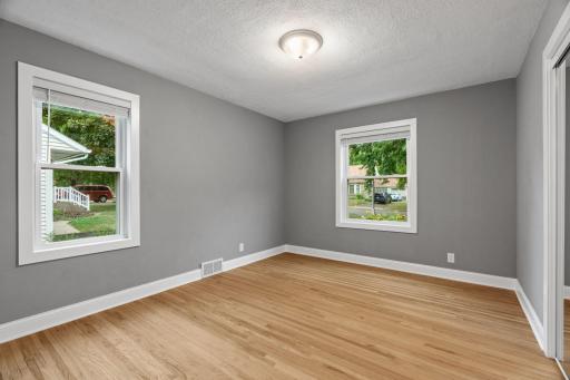 Second main floor bedroom with overhead light.
