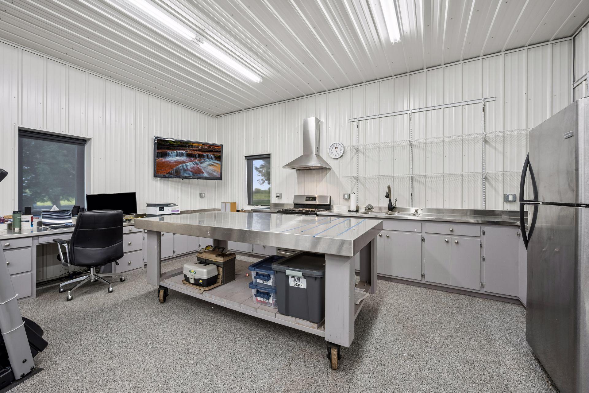 Detached Garage Featuring a Full Kitchen & Convenient Half Bath