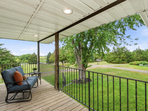 AI virtually staged to help showcase the deckâs outdoor living potential.