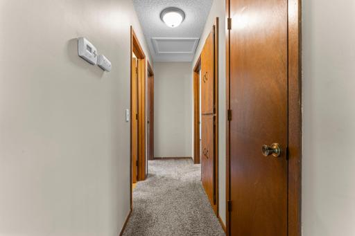 Hallway offers a coat closet & a large linen closet near the bathroom and bedrooms