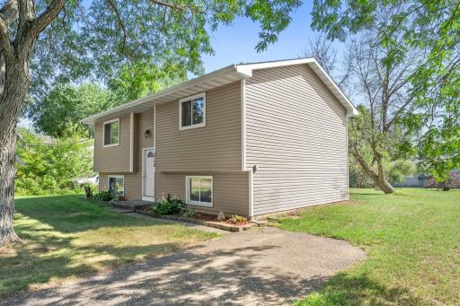 Nicely landscaped and a sidewalk off the driveway