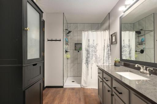 Modern bath with stylish updates- upper level