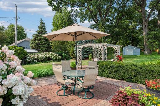 The fully-fenced back yard is a beautiful oasis, rarely found this close to the city