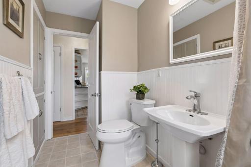 Neutral tone tile graces the bathroom floor