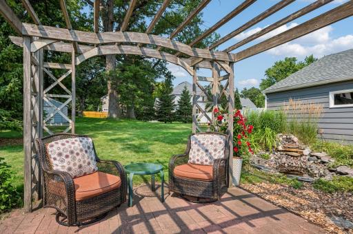 An arbor provides dappled shade in the Summer.