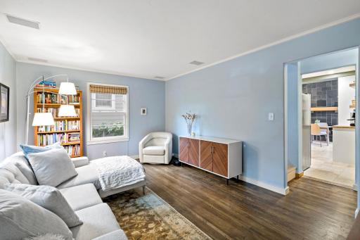 Hardwood floors, crown molding, and natural light - the living room sets a warm, welcoming tone from the moment you walk in.