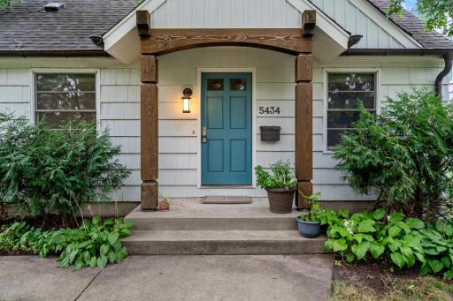 A lush, tree-shaded front yard and classic walkway welcome you home to this beloved Armatage gem.