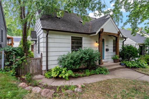 Custom copper gutters add a unique, luxe touch to this home tucked on a quiet Armatage street just half a block from Minnehaha Creek.