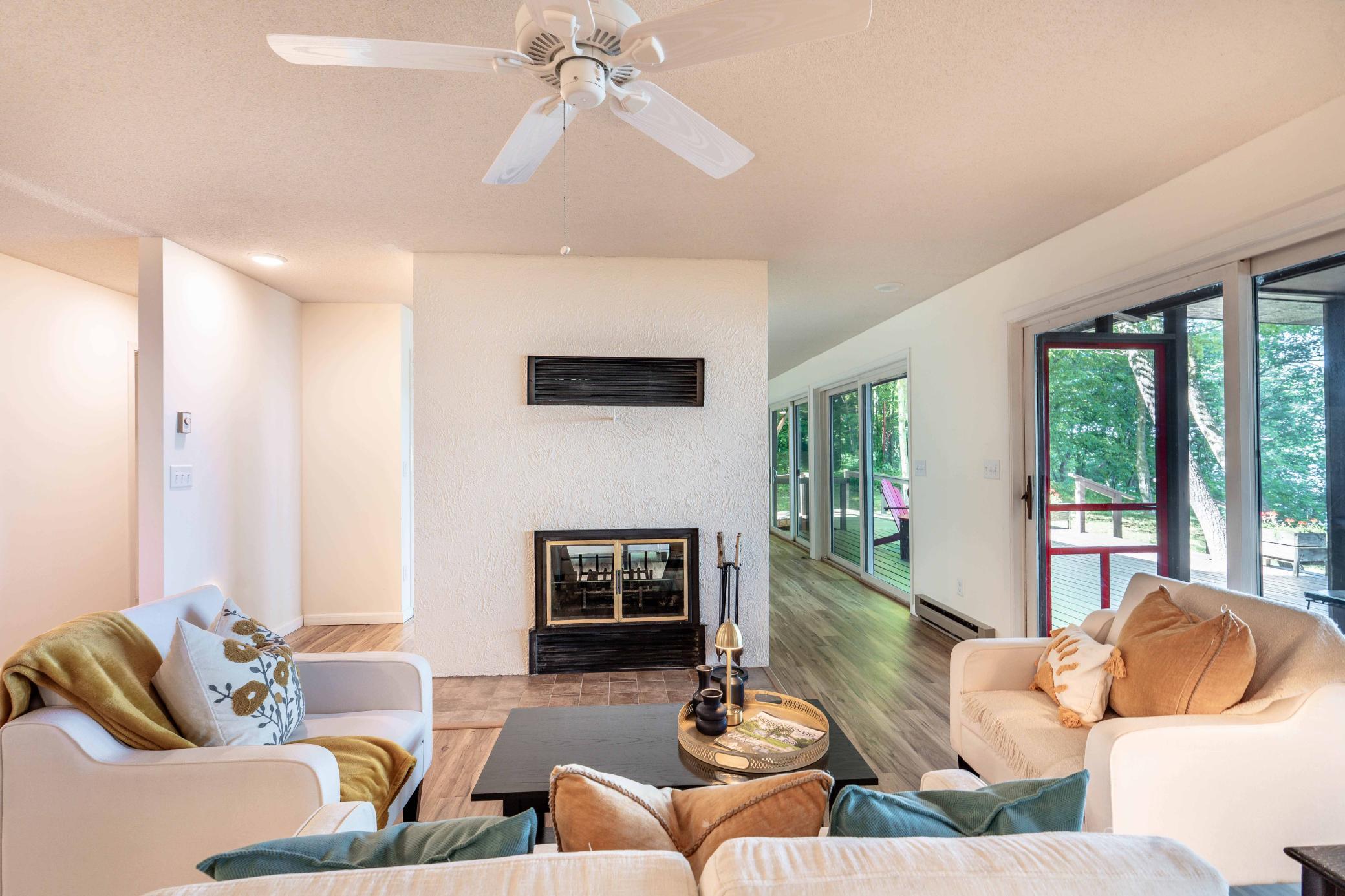Imagine cool evenings with the wood burning fireplace warming this living room and more.