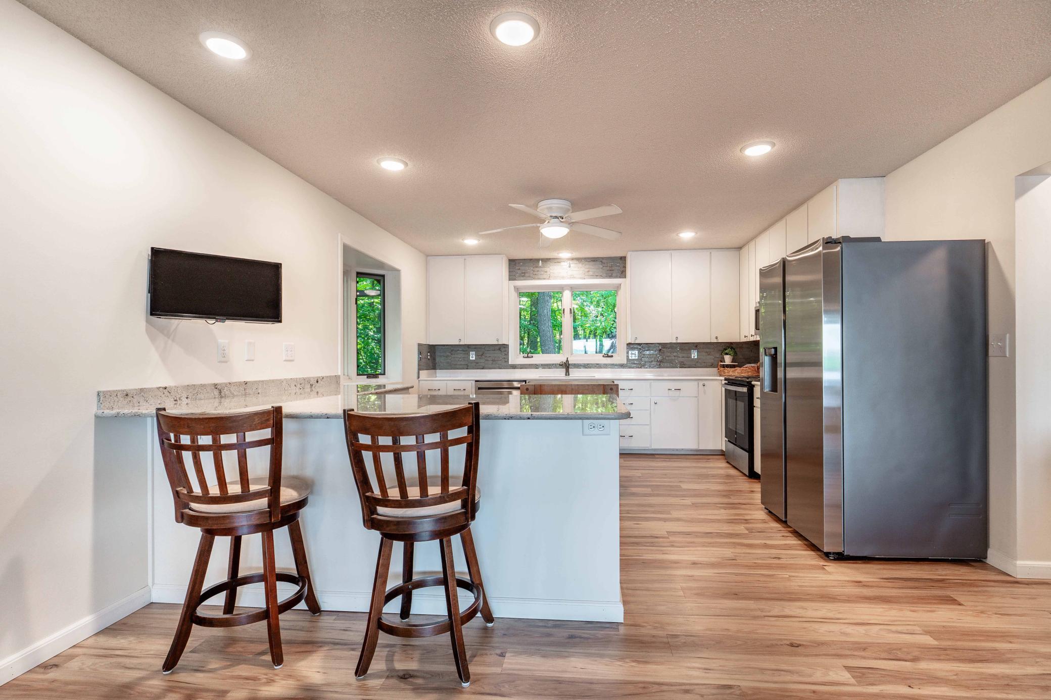 Kitchen will accommodate numerous cooks. Abundance of countertops and cabinetry.