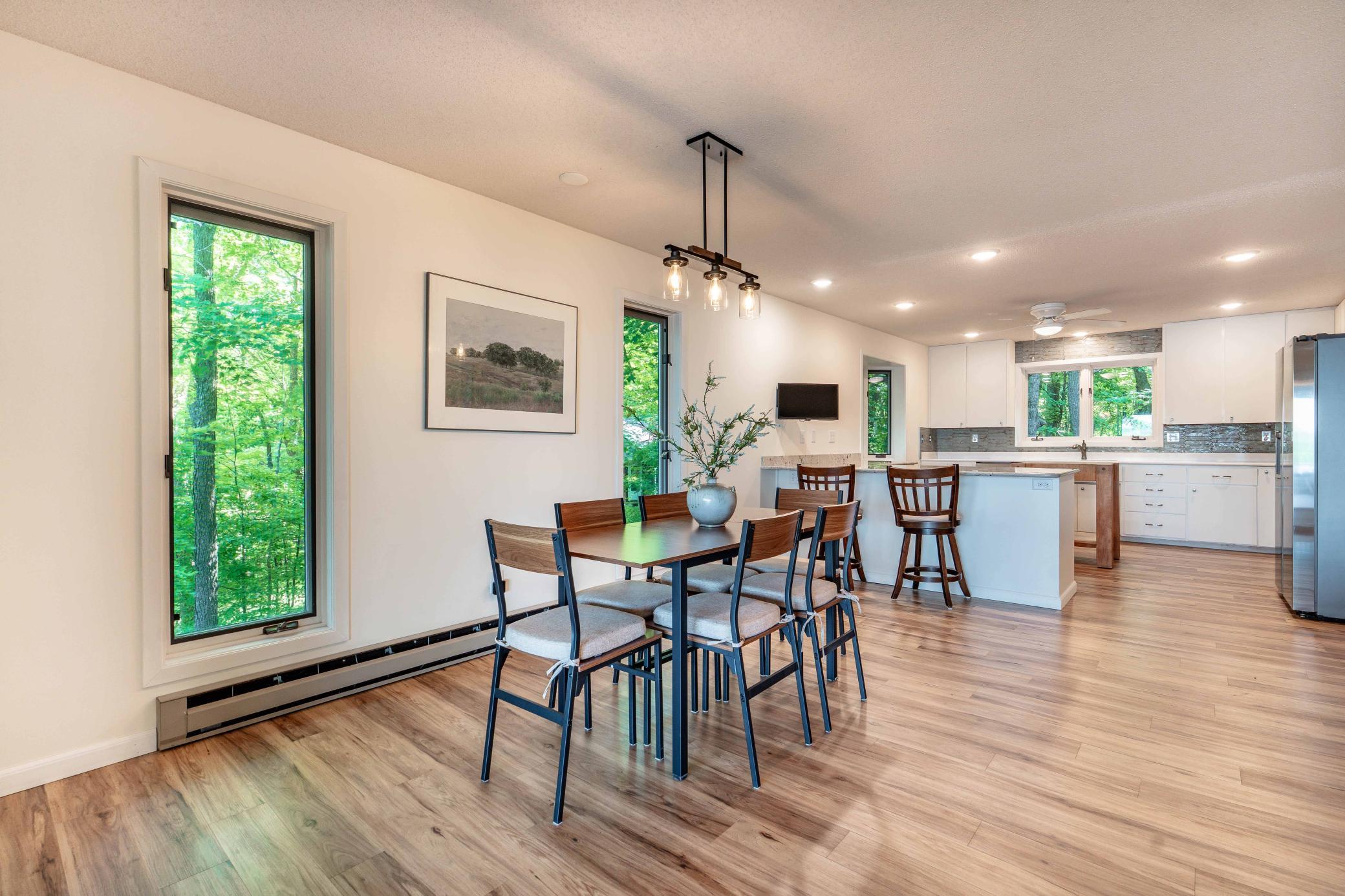Alternate view into the spacious kitchen with dine at counter. Newer LVP throughout the home.